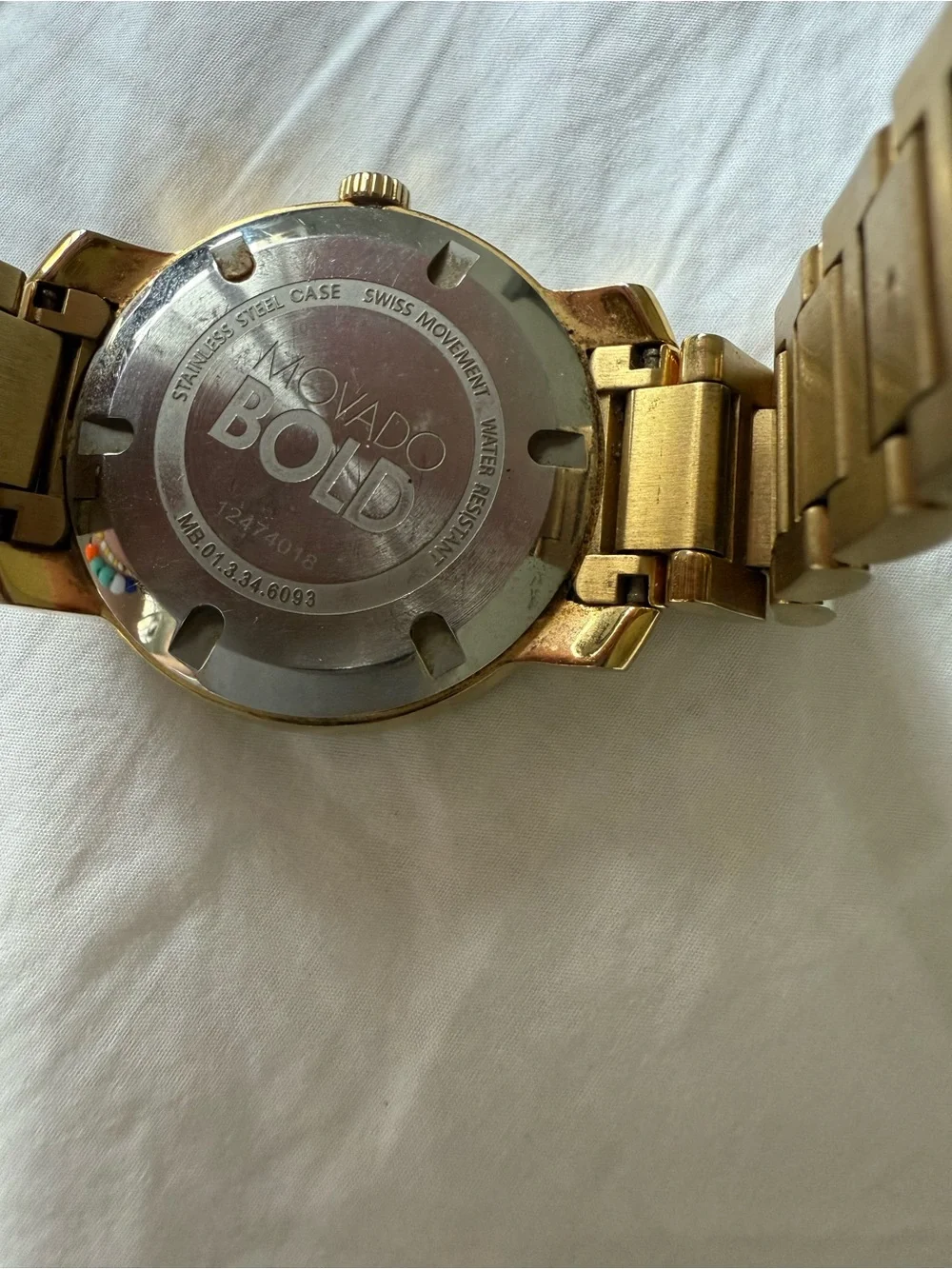 Movado Bold gold watch with box and card